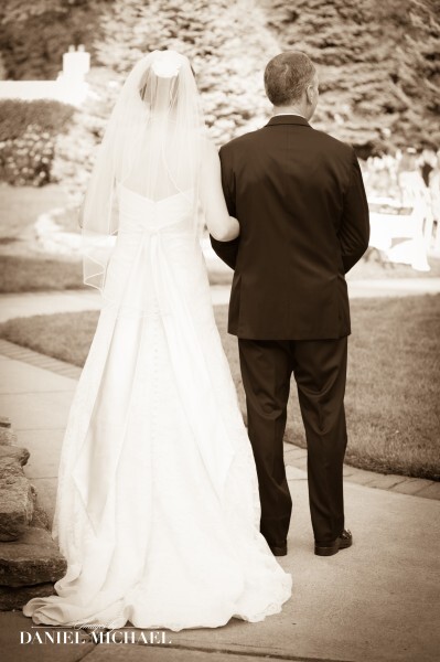 Bride walking with man down sidewalk